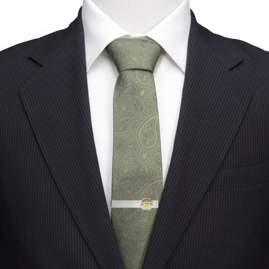 Polished metal Grogu tie bar on a blue necktie