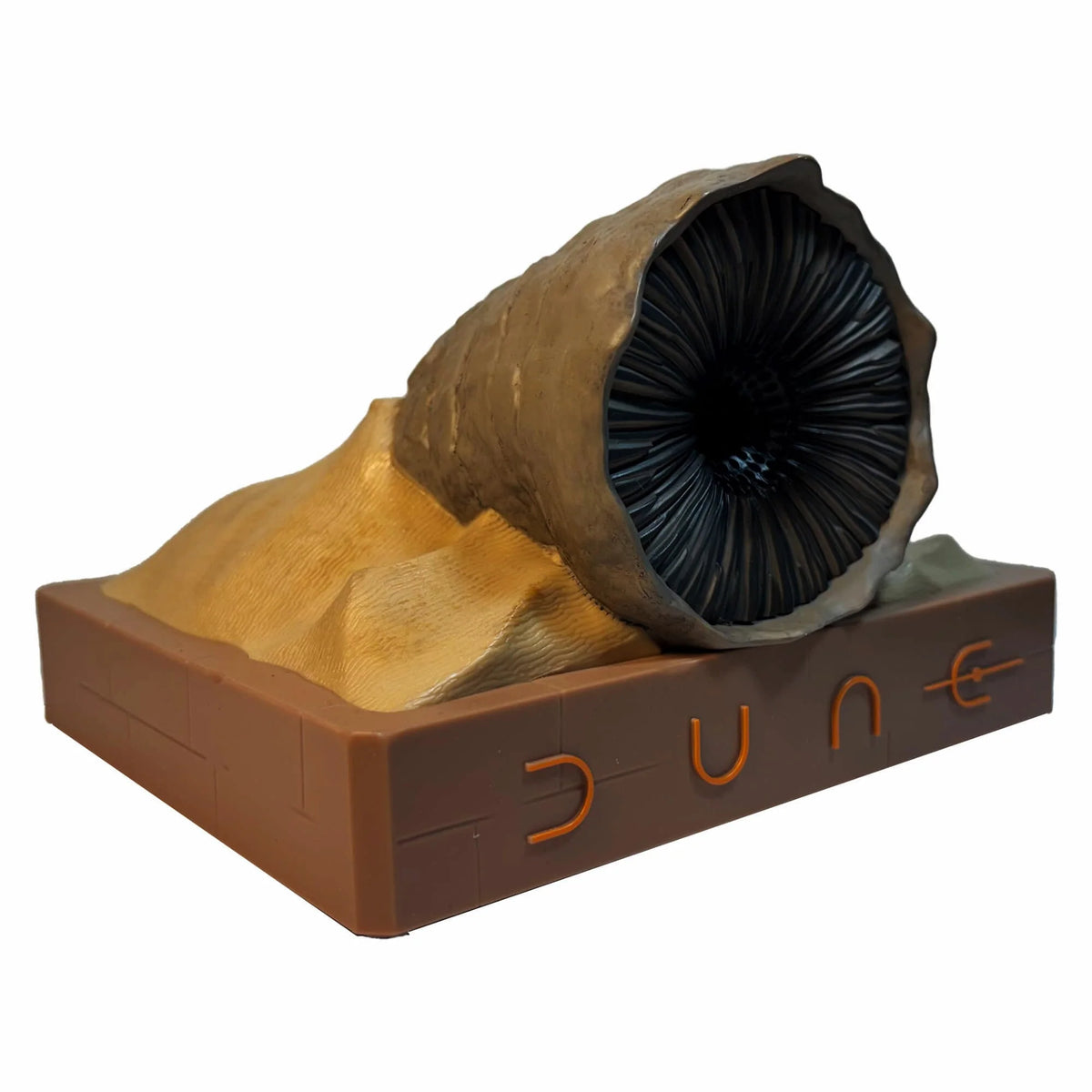 Front three-quarter view of the Dune Shai-Hulud Sandworm Bluetooth speaker atop its textured limestone base