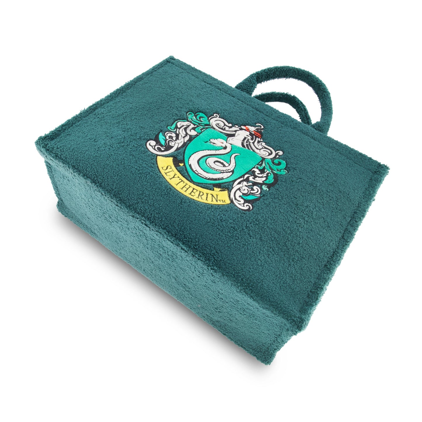 Close up of the embroidered Slytherin house crest on the sherpa material
