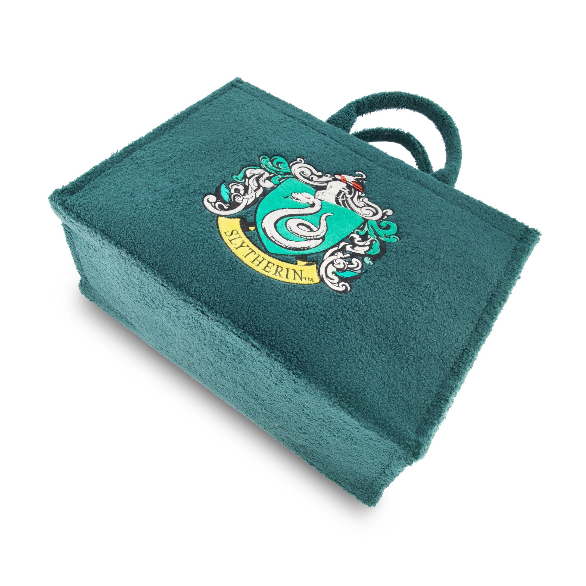Close up of the embroidered Slytherin house crest on the sherpa material