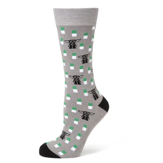 Close up of Grogu lapel pin and grey dress socks featuring Mandalorian helmet