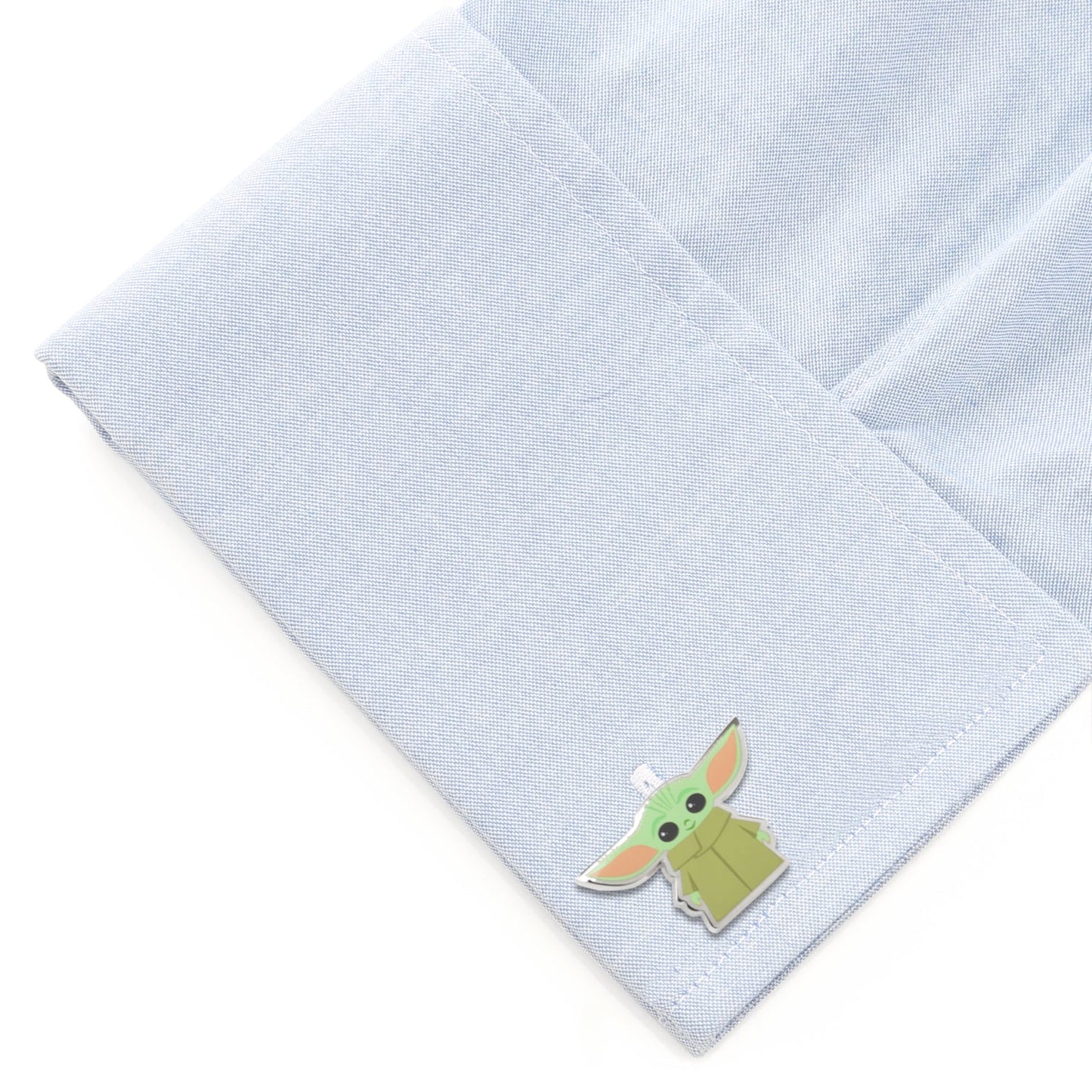 Grogu cufflinks shown with their fixed round logo backing