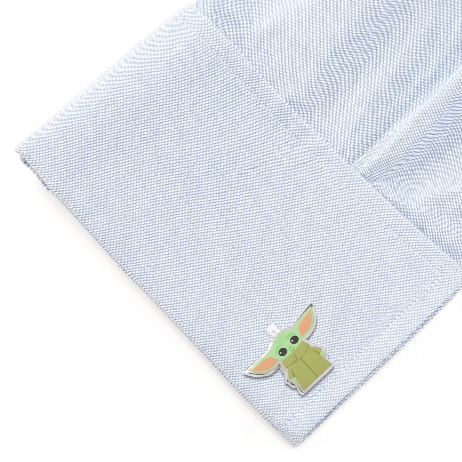 Grogu cufflinks shown with their fixed round logo backing