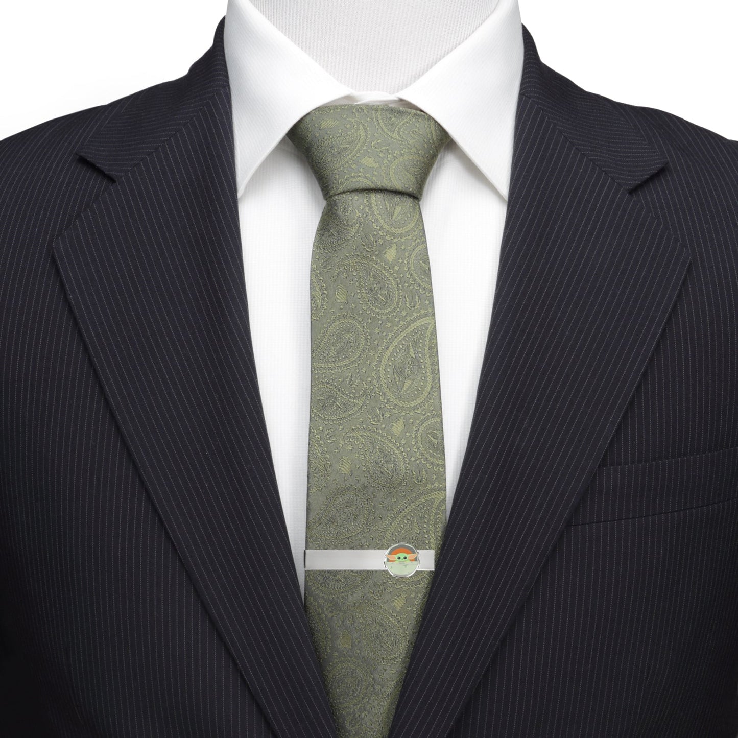 Polished metal Grogu tie bar on a blue necktie