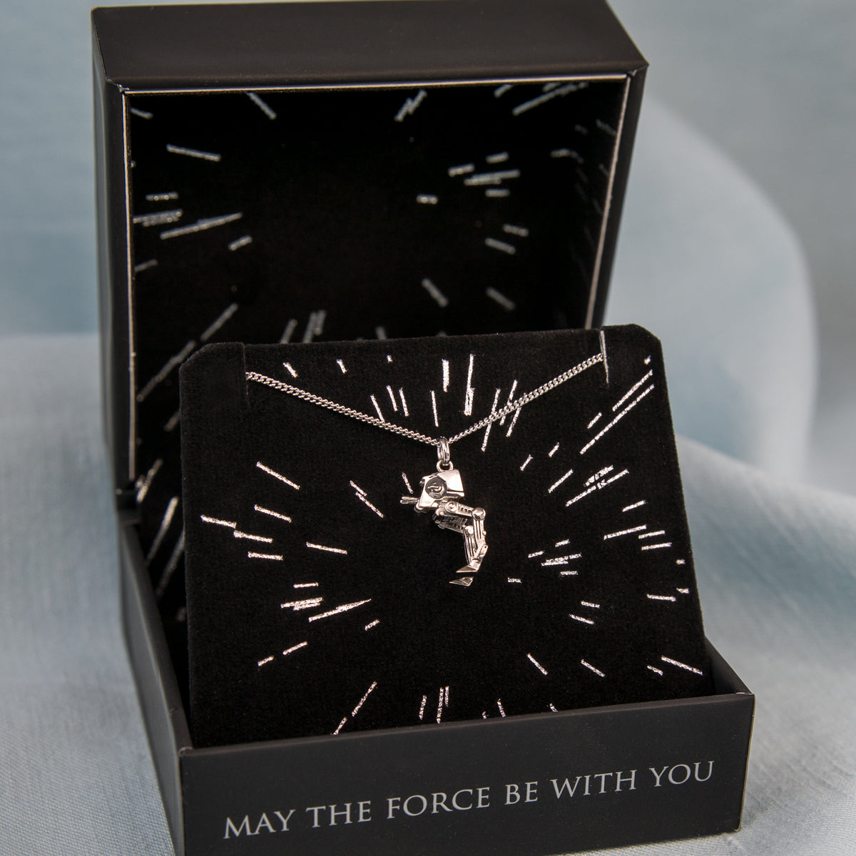 Polished sterling silver Star Wars pendant texture