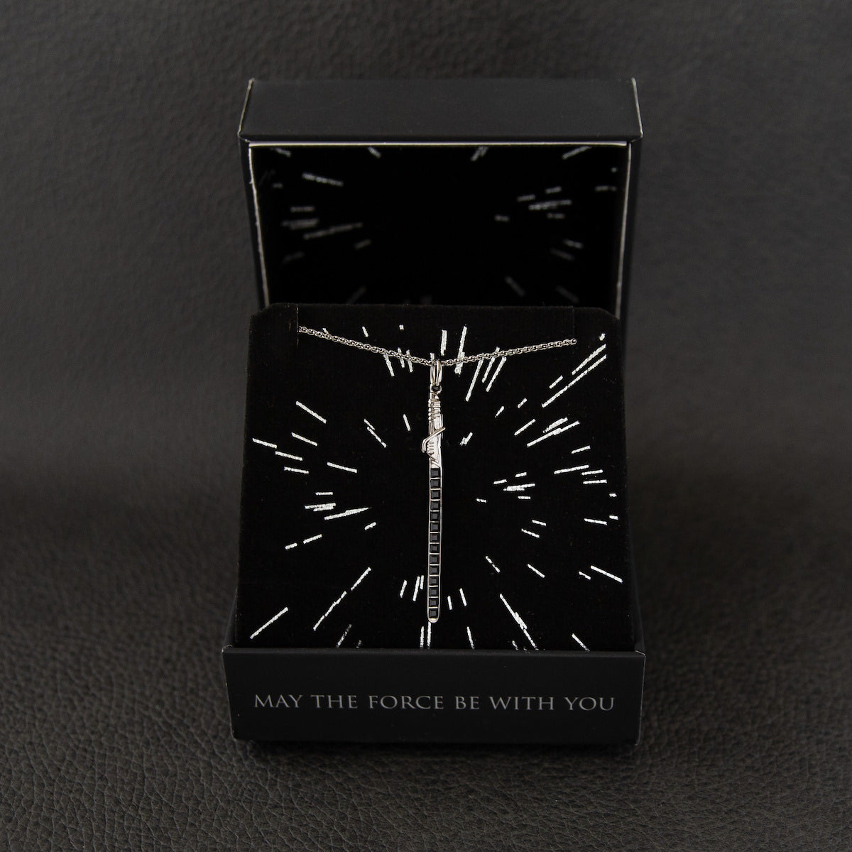 Darksaber necklace being worn to show scale and length