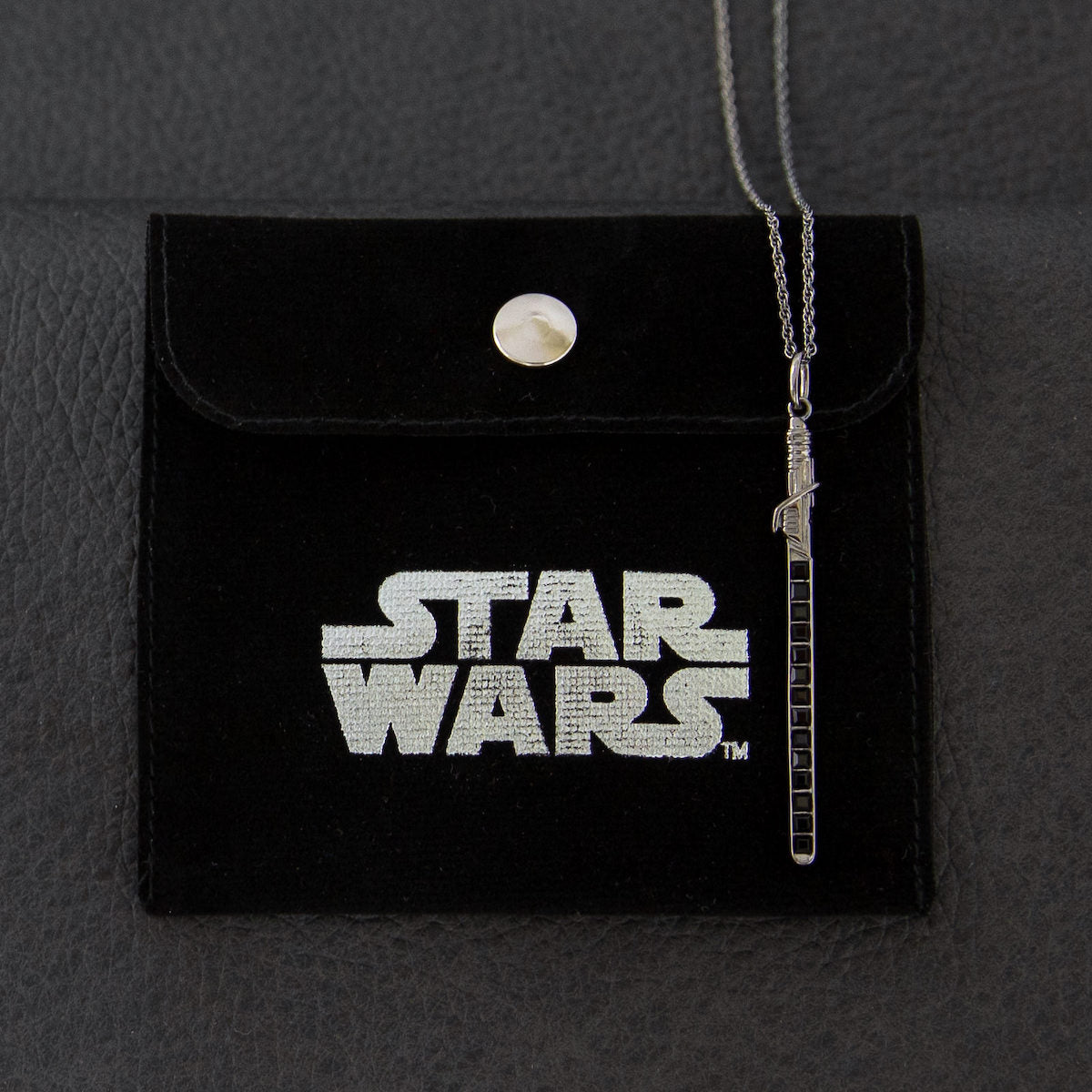 Back view of the Darksaber necklace pendant with hallmark stamps