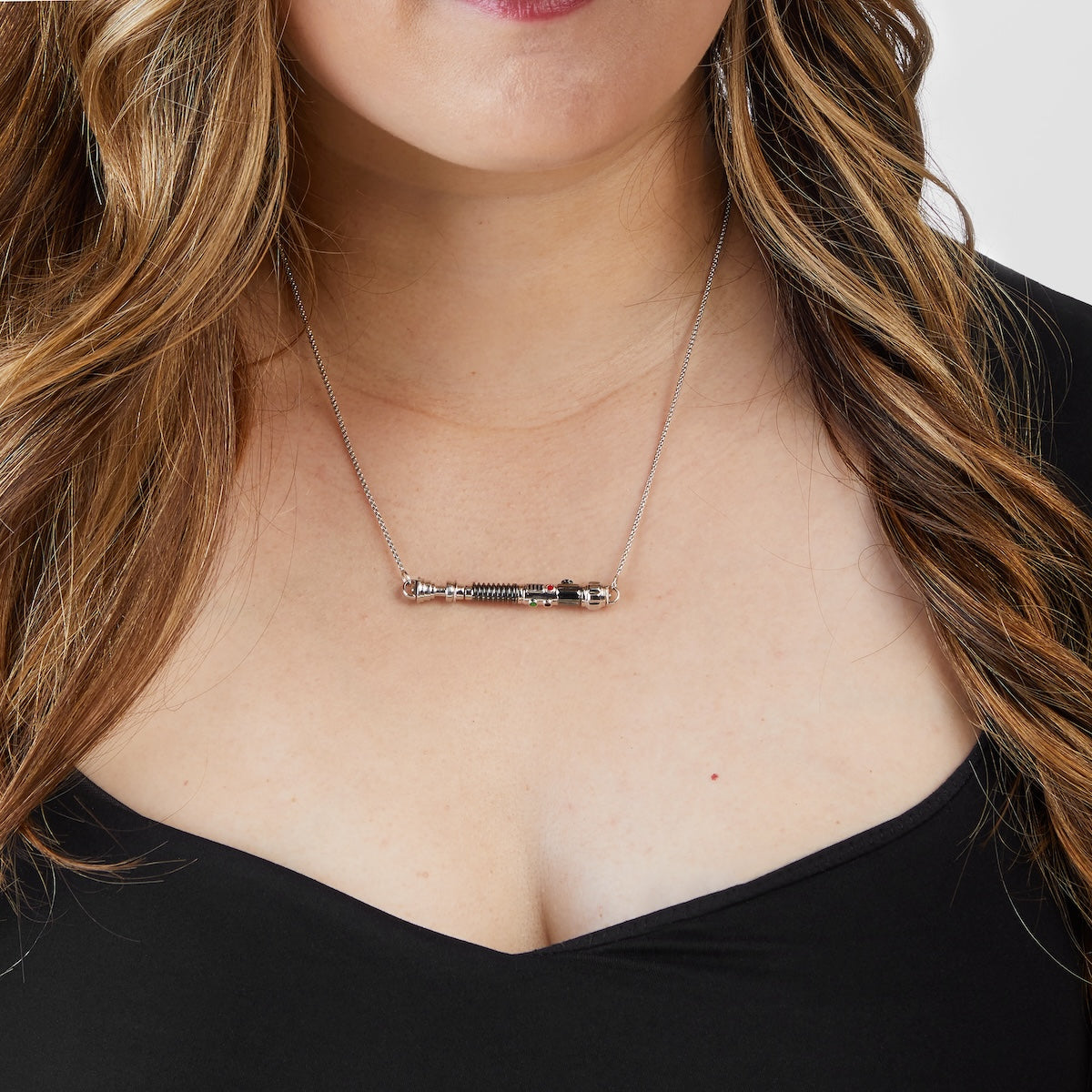 Close-up of the black and white rhodium plated finish on the lightsaber hilt pendant.