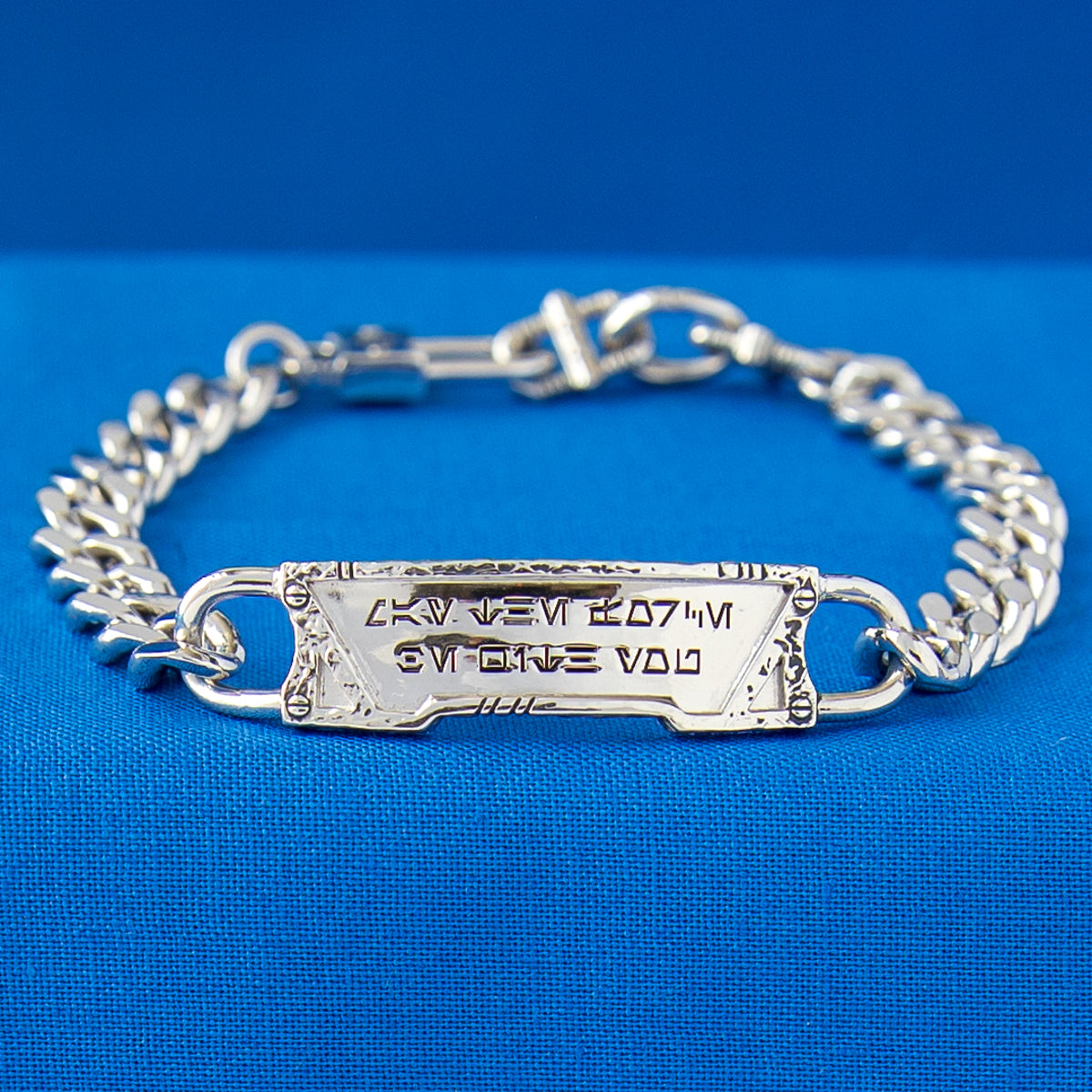Detail shot of the custom-sculpted in-world clasp and weathered finish.