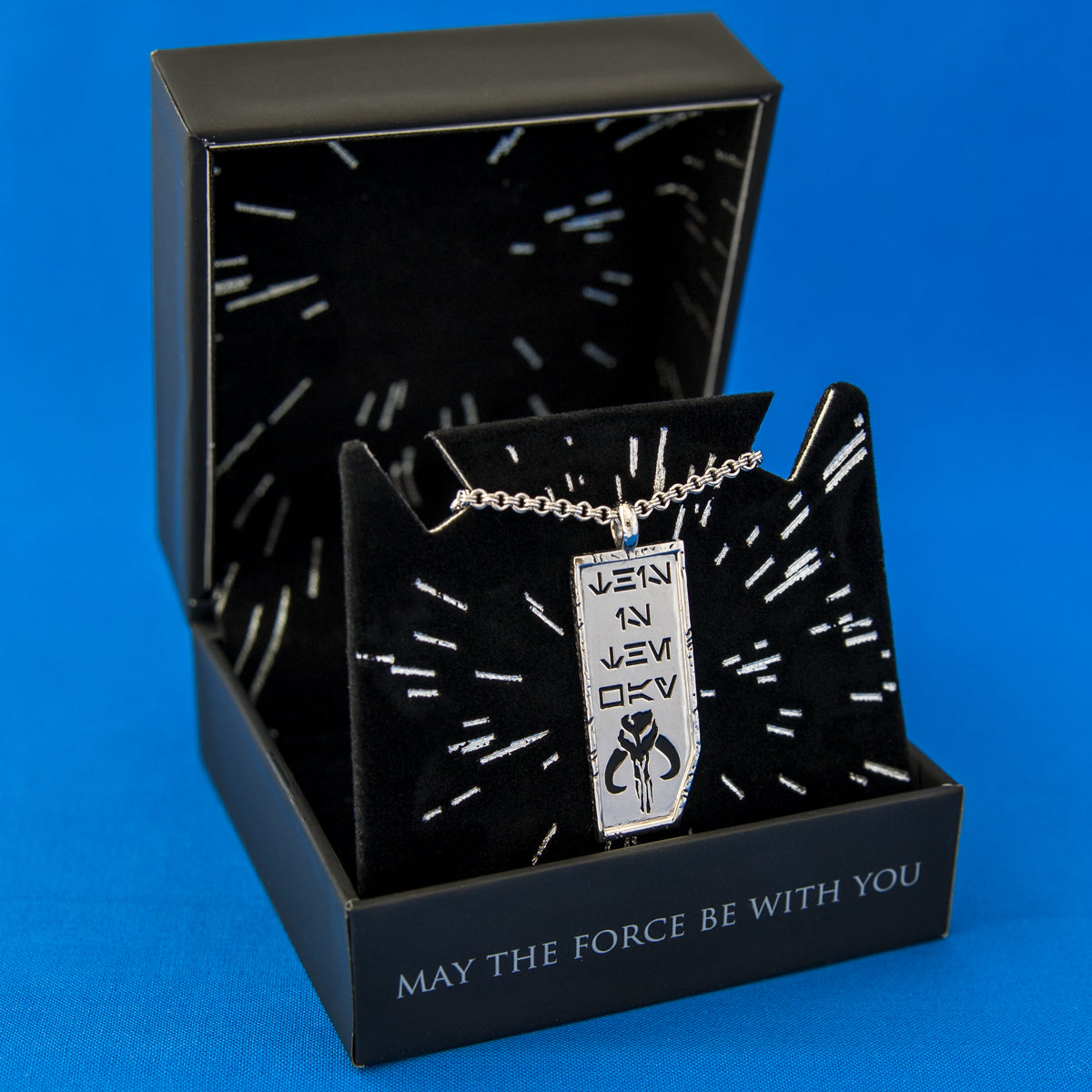 Lifestyle view of the Star Wars This Is the Way pendant necklace highlighting its weighted and tactile design.