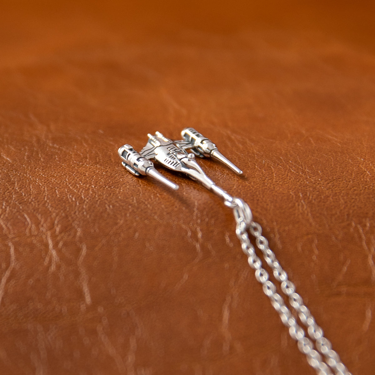 Side view showing the engine thrusters of the N-1 Starfighter pendant