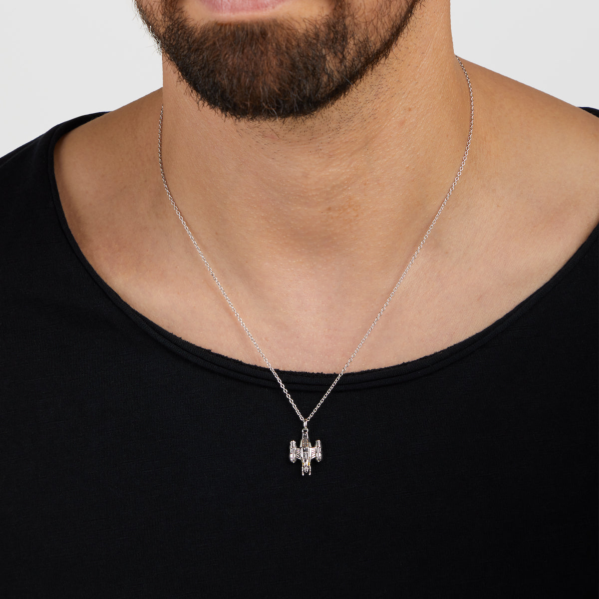 Detail of the amber cubic zirconia engine thrusters on the Razor Crest necklace