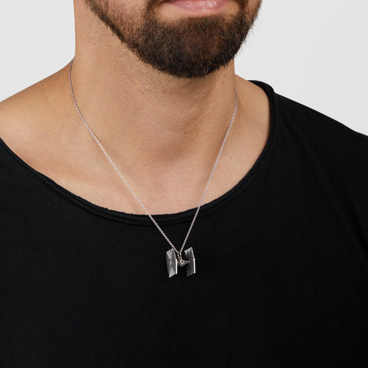Close up of 3D TIE Fighter pendant with black cubic zirconia crystal