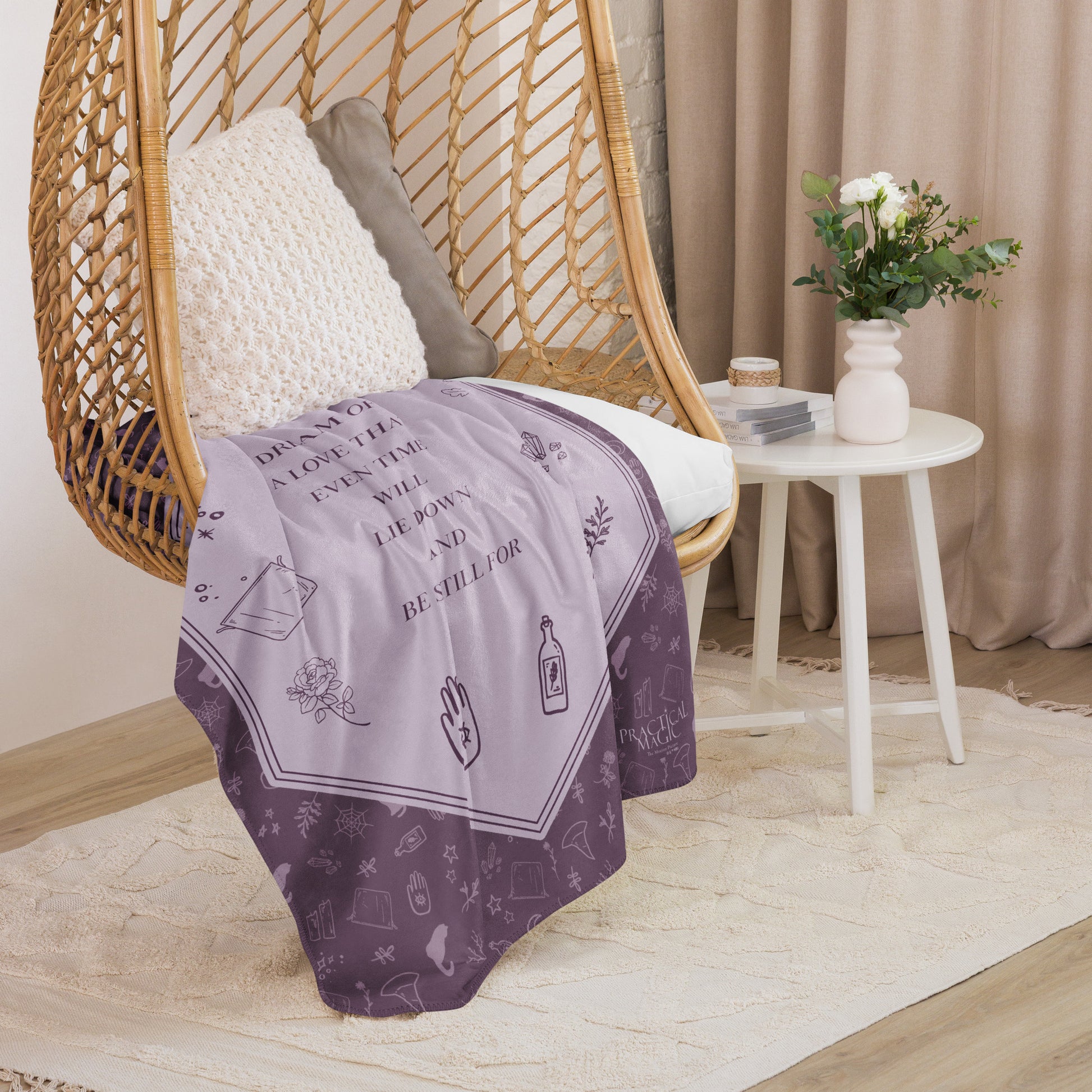 Practical Magic sherpa blanket held to show the scale and softness.